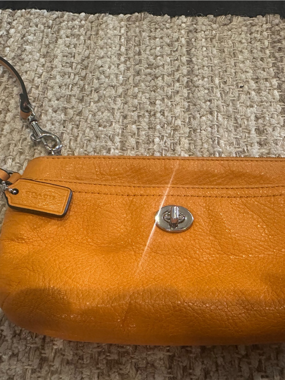 Coach Soft Leather Orange Pebbled Leather Turnlock Wristlet. NWOT